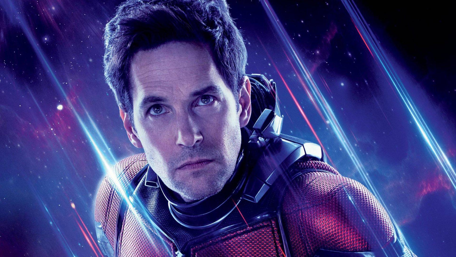 HD PC desktop wallpaper featuring Paul Rudd as Ant-Man from Avengers Endgame with a cosmic background and glowing light streaks.