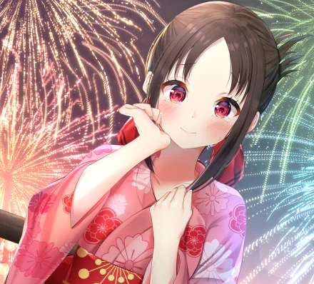 HD wallpaper featuring Kaguya Shinomiya from the anime Kaguya-sama: Love is War, standing against a backdrop of bright fireworks, dressed in a pink floral yukata and smiling softly.