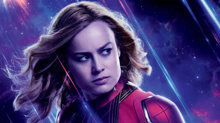 HD wallpaper featuring Brie Larson as Captain Marvel, set against a cosmic backdrop from the movie Avengers: EndGame.