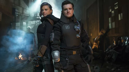 HD desktop wallpaper featuring two individuals in futuristic attire standing confidently amidst a dimly-lit, dystopian setting.