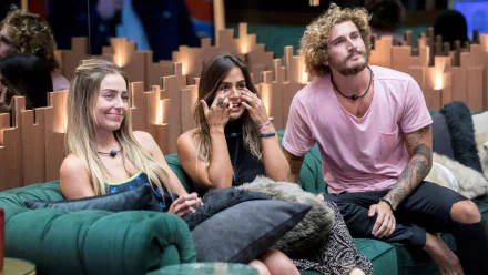 HD wallpaper of Big Brother Brasil contestants seated in a lounge, expressing varied emotions.