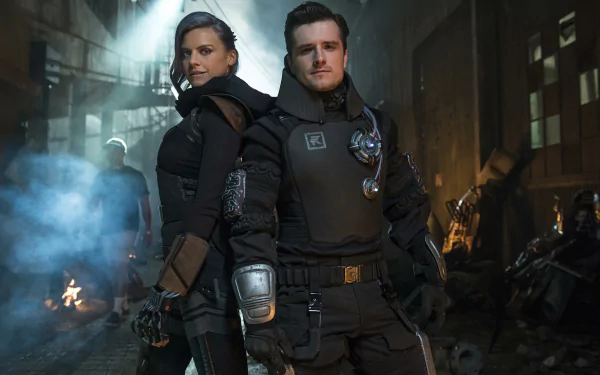 HD desktop wallpaper featuring two individuals in futuristic attire standing confidently amidst a dimly-lit, dystopian setting.