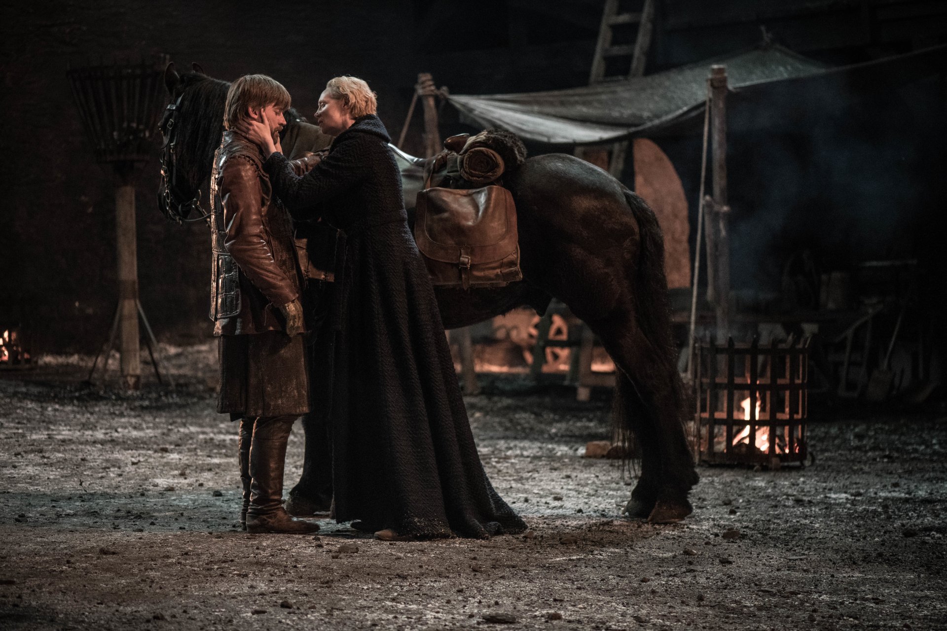 Brienne of Tarth and Jaime Lannister stand close beside a saddled horse in a smoky camp — Game of Thrones, 2K Quad HD PC desktop wallpaper.