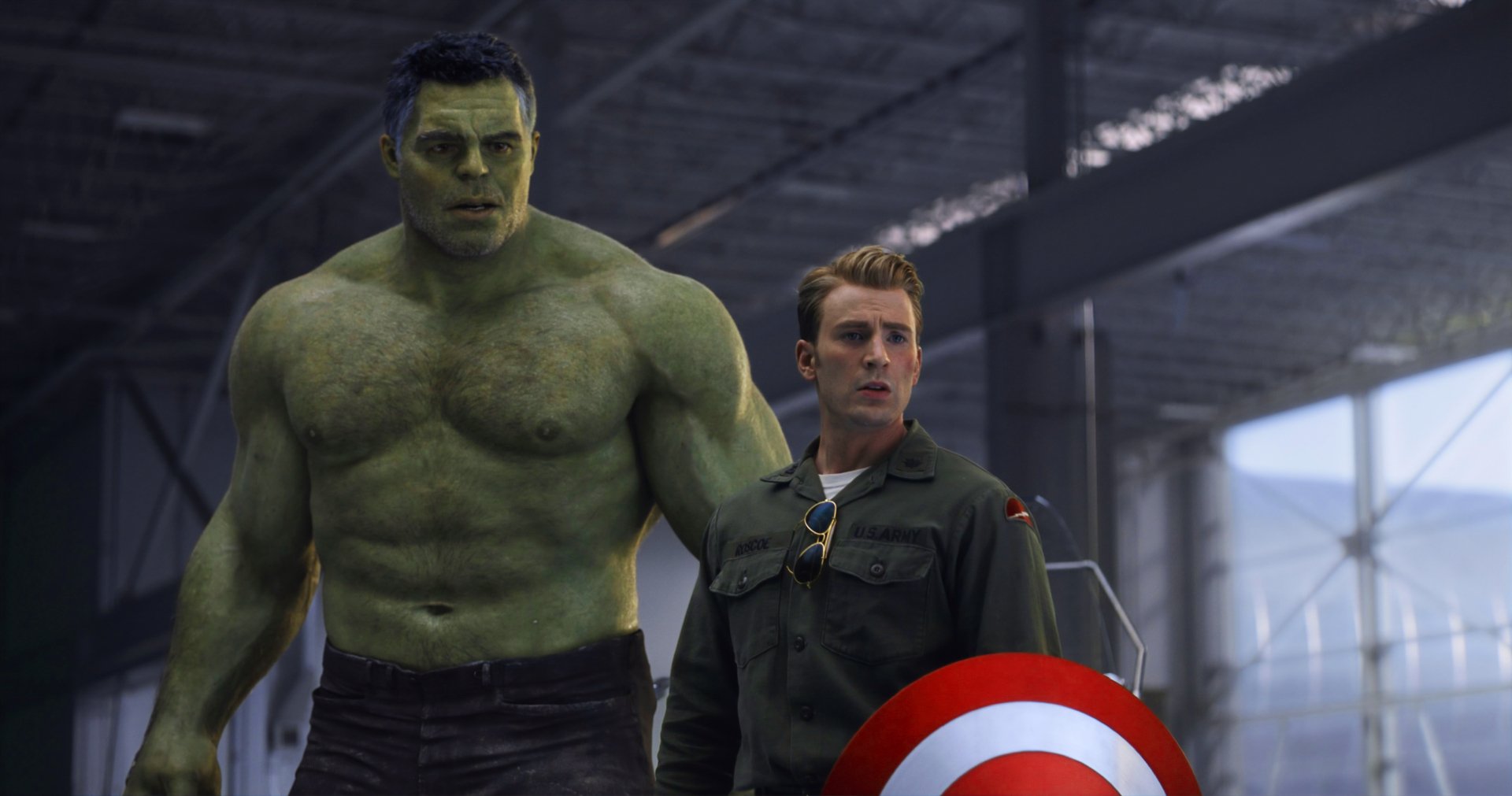 HD desktop wallpaper featuring Hulk and Steve Rogers (Captain America) from the movie Avengers EndGame in an industrial setting.