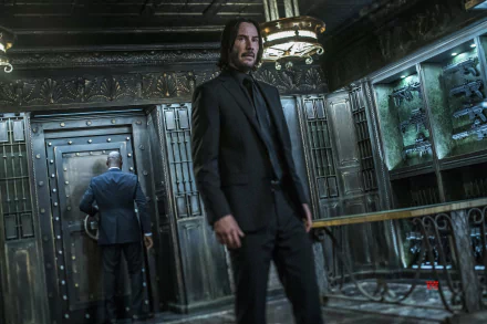Keanu Reeves as John Wick in a dark, ornate room from John Wick: Chapter 3 - Parabellum, presented as a 4K Ultra HD PC desktop wallpaper.