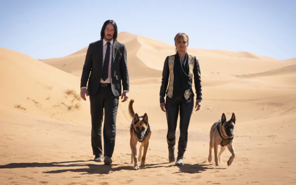 Two lead characters and two German shepherds stride across sunlit desert dunes in a scene from John Wick: Chapter 3 – Parabellum, 2K Quad HD PC desktop wallpaper.
