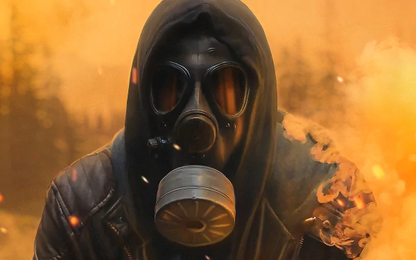 Dark-themed HD PC desktop wallpaper featuring a figure in a gas mask and hood surrounded by an orange smoky atmosphere.