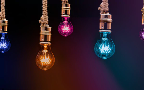 Vibrant colored light bulbs hanging by ropes against a dark background, showcased in 4K Ultra HD for a striking PC desktop wallpaper.