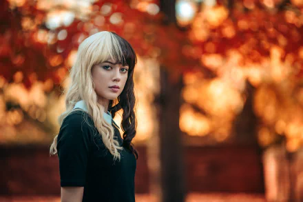 Portrait of a woman model with two-toned hair against a blurred autumn background, captured in stunning 4K Ultra HD depth of field for a PC desktop wallpaper.