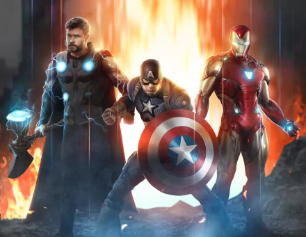 HD PC desktop wallpaper: Iron Man, Captain America, and Thor from the Avengers EndGame movie, standing in a heroic pose before a blazing, cinematic background.