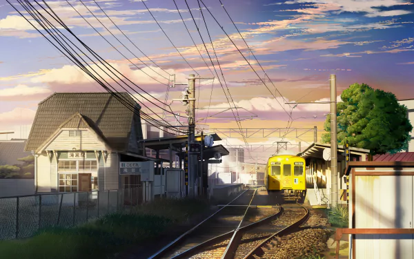 HD anime desktop wallpaper depicting a vibrant train station with a yellow train arriving under a colorful sky.