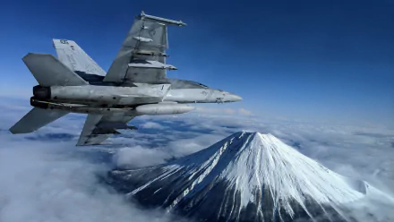 Boeing F/A-18E/F Super Hornet jet fighter flies above clouds near a snow-capped volcanic peak, captured in 4K Ultra HD for a dramatic military desktop wallpaper.