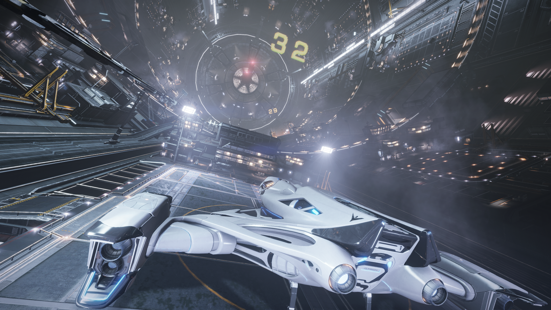 HD PC desktop wallpaper: sleek spaceship inside a vast space station from the video game Elite: Dangerous, cockpit view with glowing lights and towering docking bays.