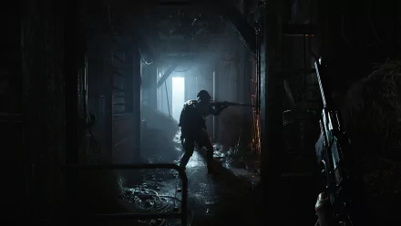 HD desktop wallpaper of Hunt: Showdown featuring a hunter with a shotgun in a dimly lit, eerie corridor.