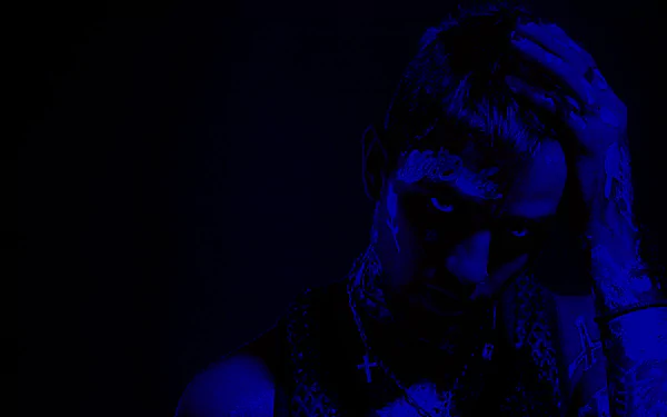 Dark blue-lit, high-contrast portrait of a solo musician, HD PC desktop wallpaper conveying a moody, melancholic music vibe.