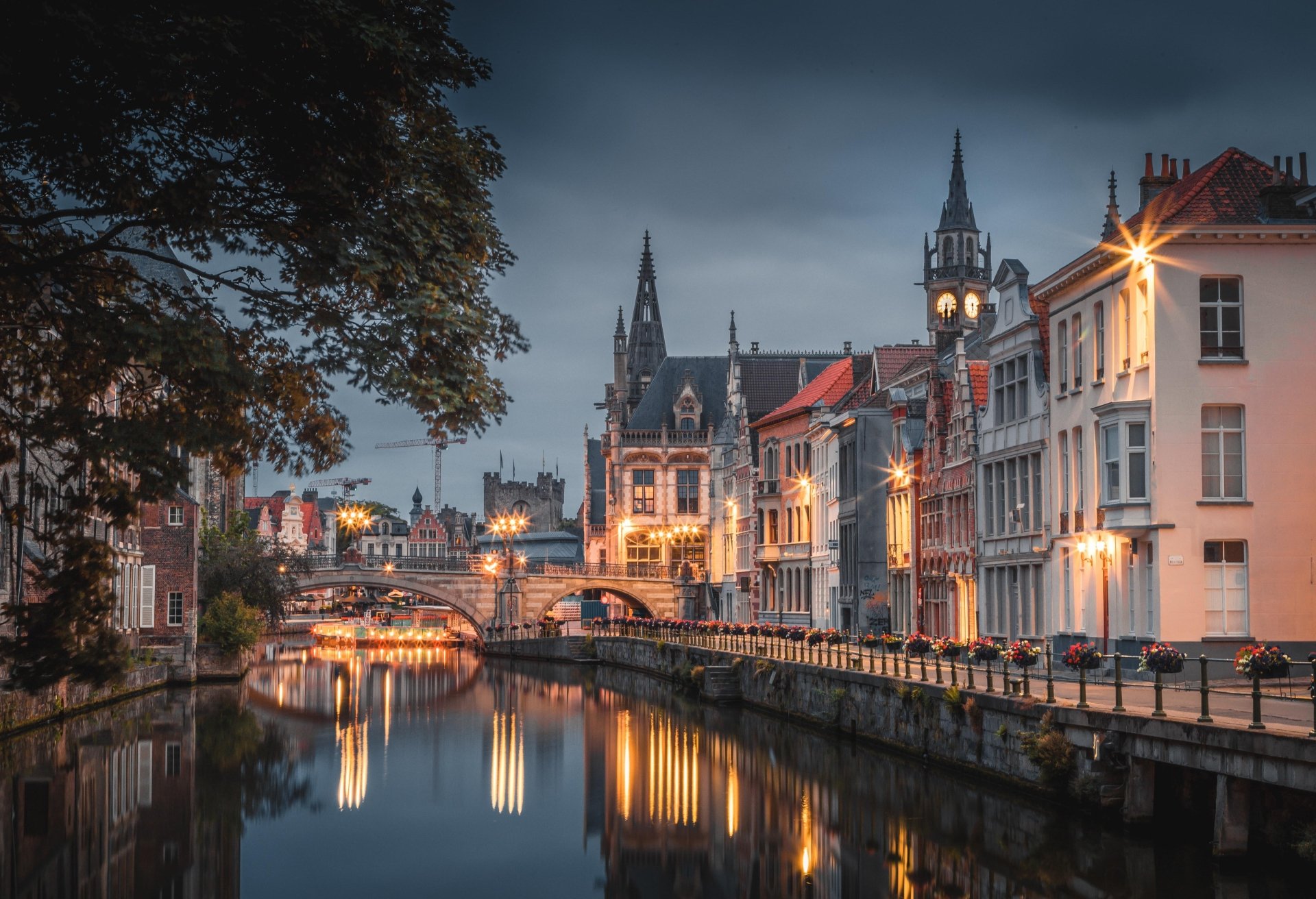 A serene night view of Ghent's historic man-made canals and illuminated buildings, captured in stunning 4K Ultra HD detail.