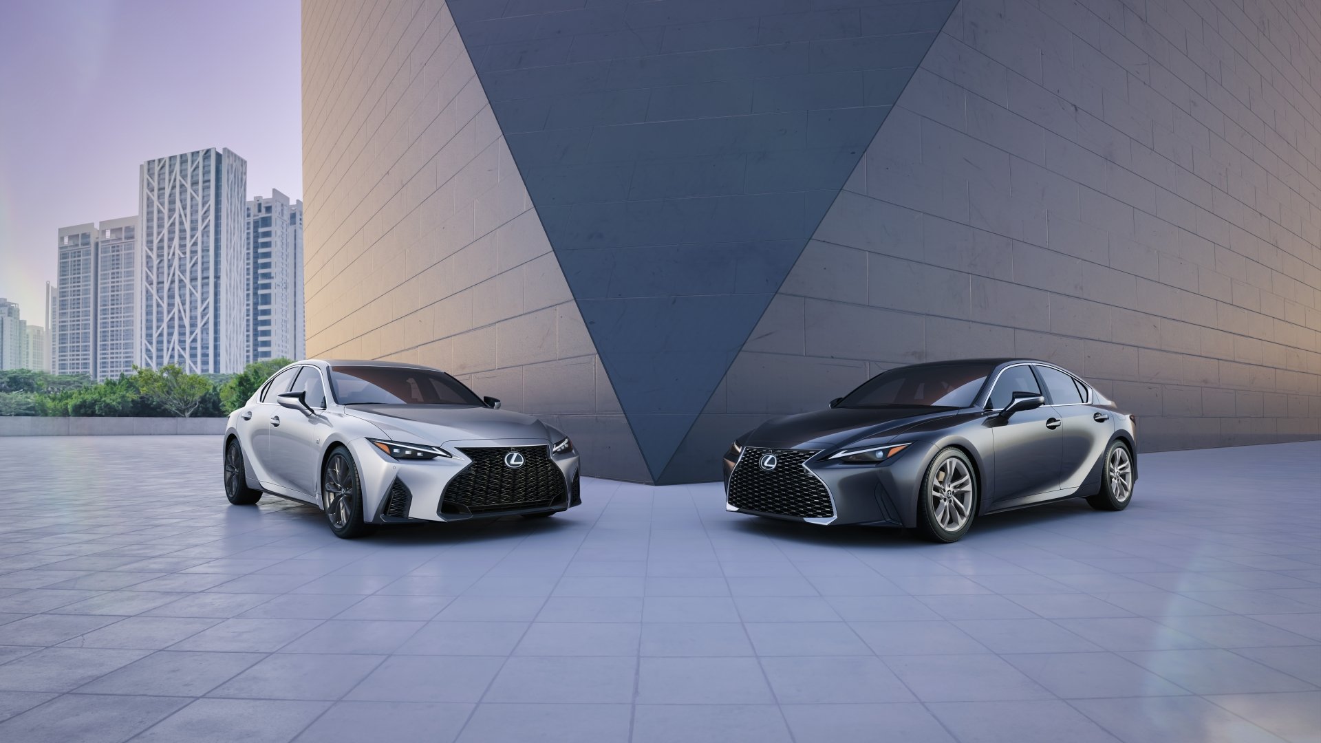 Silver and black Lexus IS cars parked symmetrically before a modern angular building — a 5K Ultra HD PC desktop wallpaper of Lexus vehicles.