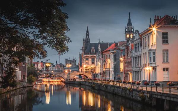 A serene night view of Ghent's historic man-made canals and illuminated buildings, captured in stunning 4K Ultra HD detail.