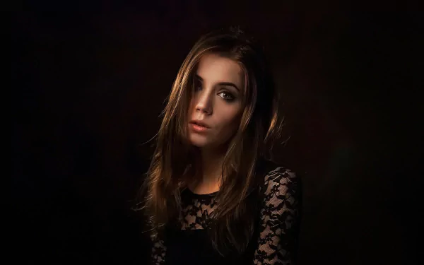 HD PC desktop wallpaper — moody studio portrait of a Russian woman model in a black lace top against a dark, low-lit background.
