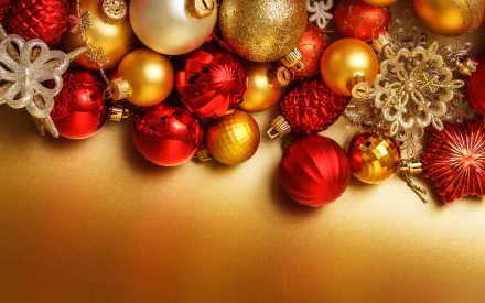 Christmas holiday decoration collage of red and gold baubles and snowflake ornaments on a golden gradient, 2K Quad HD PC desktop wallpaper background.