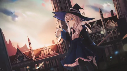 A high-definition desktop wallpaper featuring Elaina, a character from the anime The Journey of Elaina, dressed as a witch with a cityscape background at sunset.