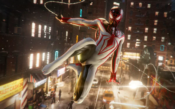 Miles Morales in his Spider-Man suit swings through a glowing cityscape in a dynamic scene from the 4K Ultra HD PC game Marvel's Spider-Man: Miles Morales.