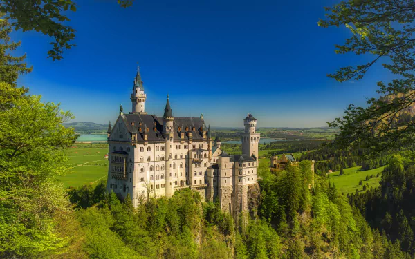 HD PC desktop wallpaper: Neuschwanstein Castle, a man-made 19th-century fairy-tale castle in Bavaria, Germany, perched on a lush green hill overlooking the valley.