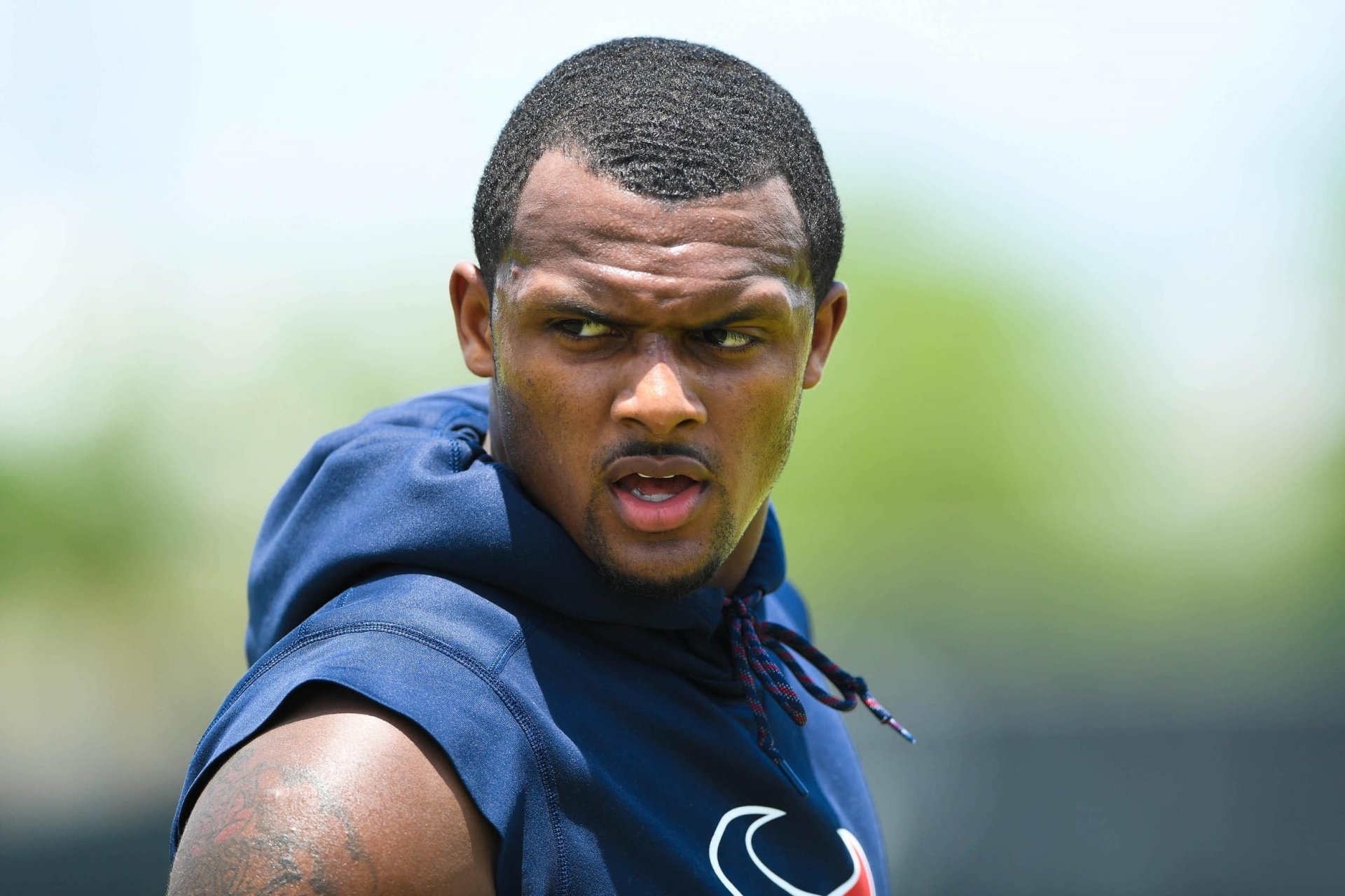 Deshaun Watson focused during a training session, showcasing his dedication to sports. This HD desktop wallpaper captures his intensity and athleticism.