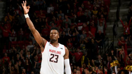 HD desktop wallpaper featuring a basketball player from Maryland, number 23, celebrating on the court.