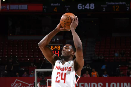 HD desktop wallpaper featuring basketball player Bruno Fernando in mid-action on the court, wearing a Hawks #24 jersey.