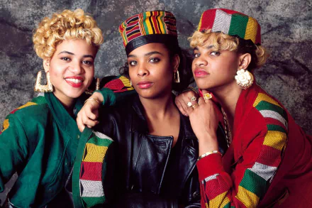 HD desktop wallpaper of Salt-N-Pepa, featuring the iconic trio posing confidently in colorful, trendy outfits.