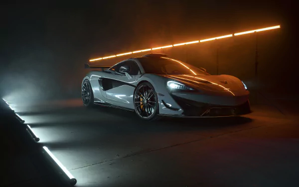 8K Ultra HD PC desktop wallpaper of a white McLaren 620R supercar staged in dramatic, moody studio lighting.