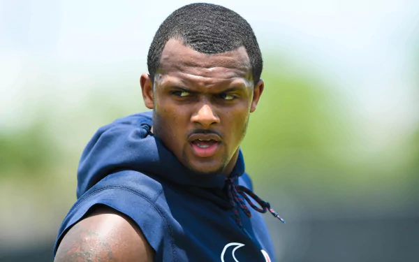 Deshaun Watson focused during a training session, showcasing his dedication to sports. This HD desktop wallpaper captures his intensity and athleticism.