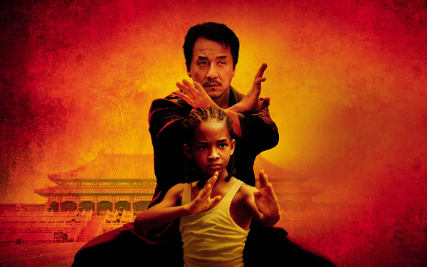4K Ultra HD wallpaper featuring Jaden Smith and Jackie Chan in a martial arts pose from the 2010 movie The Karate Kid, set against a fiery orange background.