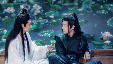 HD desktop wallpaper from the TV show The Untamed featuring Wang Yibo as Lan Wangji and Xiao Zhan as Wei Wuxian amidst a serene lotus pond setting.
