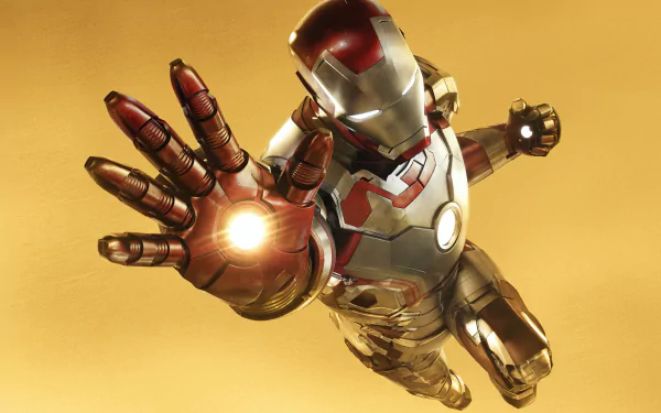 Iron Man in his suit from Iron Man 3, featured in a vibrant 4K Ultra HD PC desktop wallpaper and background with a golden yellow backdrop.