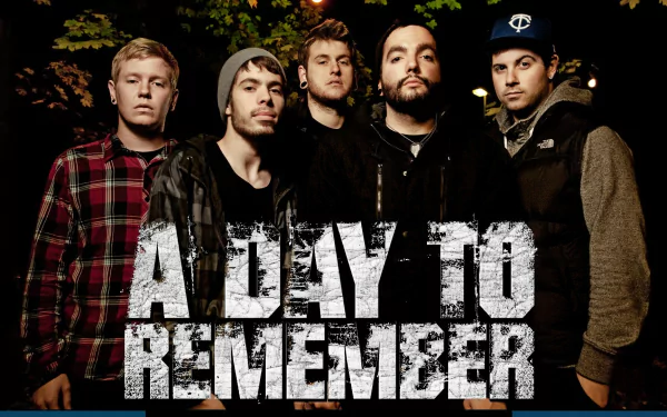 HD wallpaper of the band A Day To Remember posing for a group photo with the band's name overlaid in bold text.