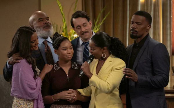 HD wallpaper featuring a scene from Dad Stop Embarrassing Me with Jamie Foxx and cast members in a group setting.