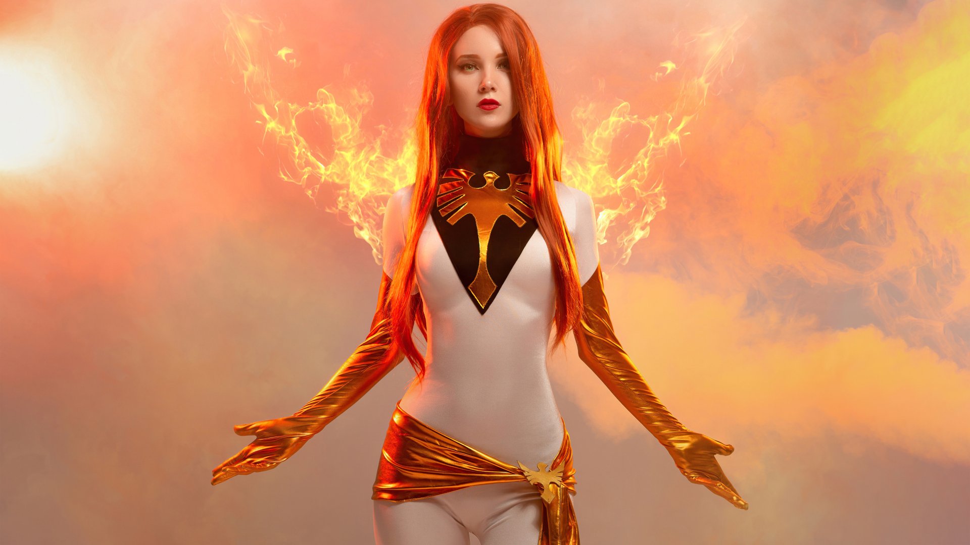 A 4K Ultra HD PC desktop wallpaper featuring a redhead woman cosplaying as Jean Grey from X-Men, surrounded by fiery, glowing energy effects.