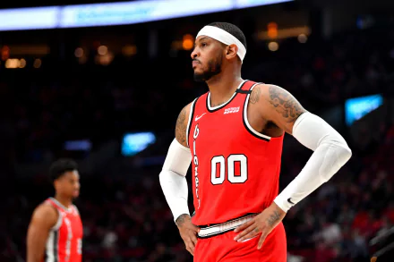 HD desktop wallpaper of a basketball player in a red jersey, ready for action on the court, creating a dynamic background.