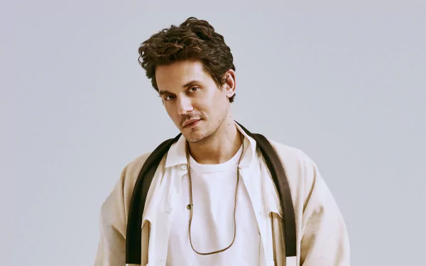 Stylish man in casual attire posing for an HD desktop wallpaper and background.