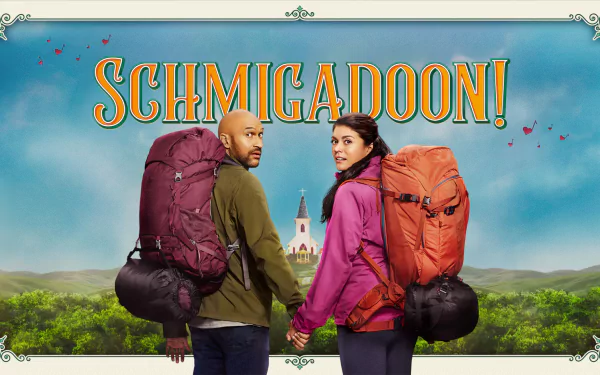 HD wallpaper of two hikers with backpacks facing a whimsical town, entitled 'Schmigadoon!' with vibrant scenery and playful font.