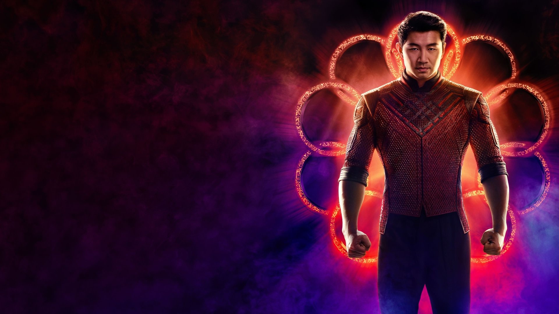 Shang-Chi from Shang-Chi and the Legend of the Ten Rings stands before glowing Ten Rings on a red‑purple 4K Ultra HD PC desktop wallpaper.