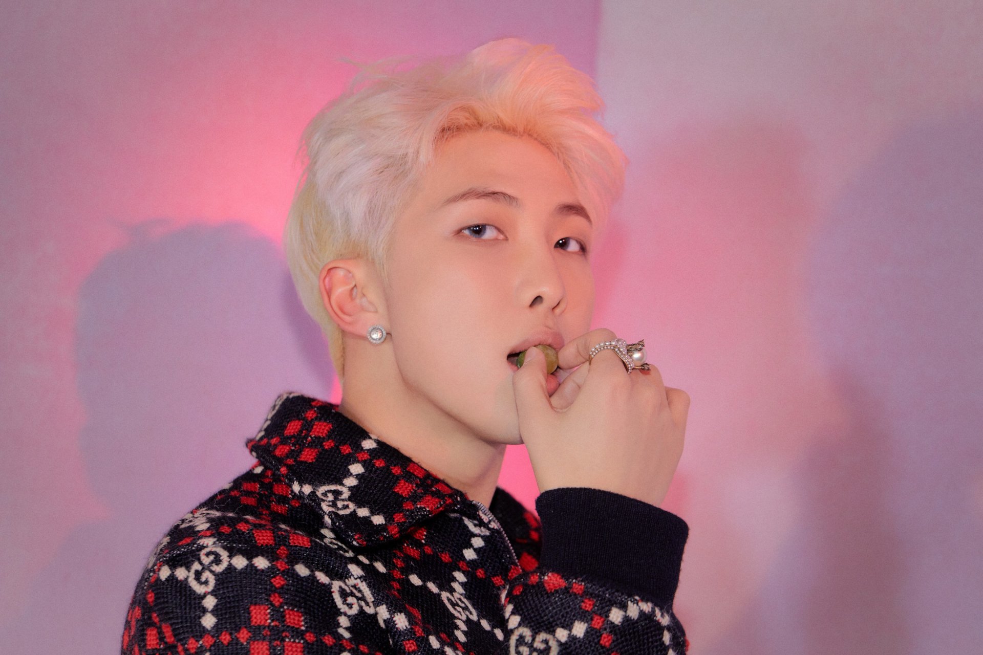 HD PC wallpaper featuring RM (Kim Namjoon) of BTS, a K-pop singer, against a soft pink and purple background.