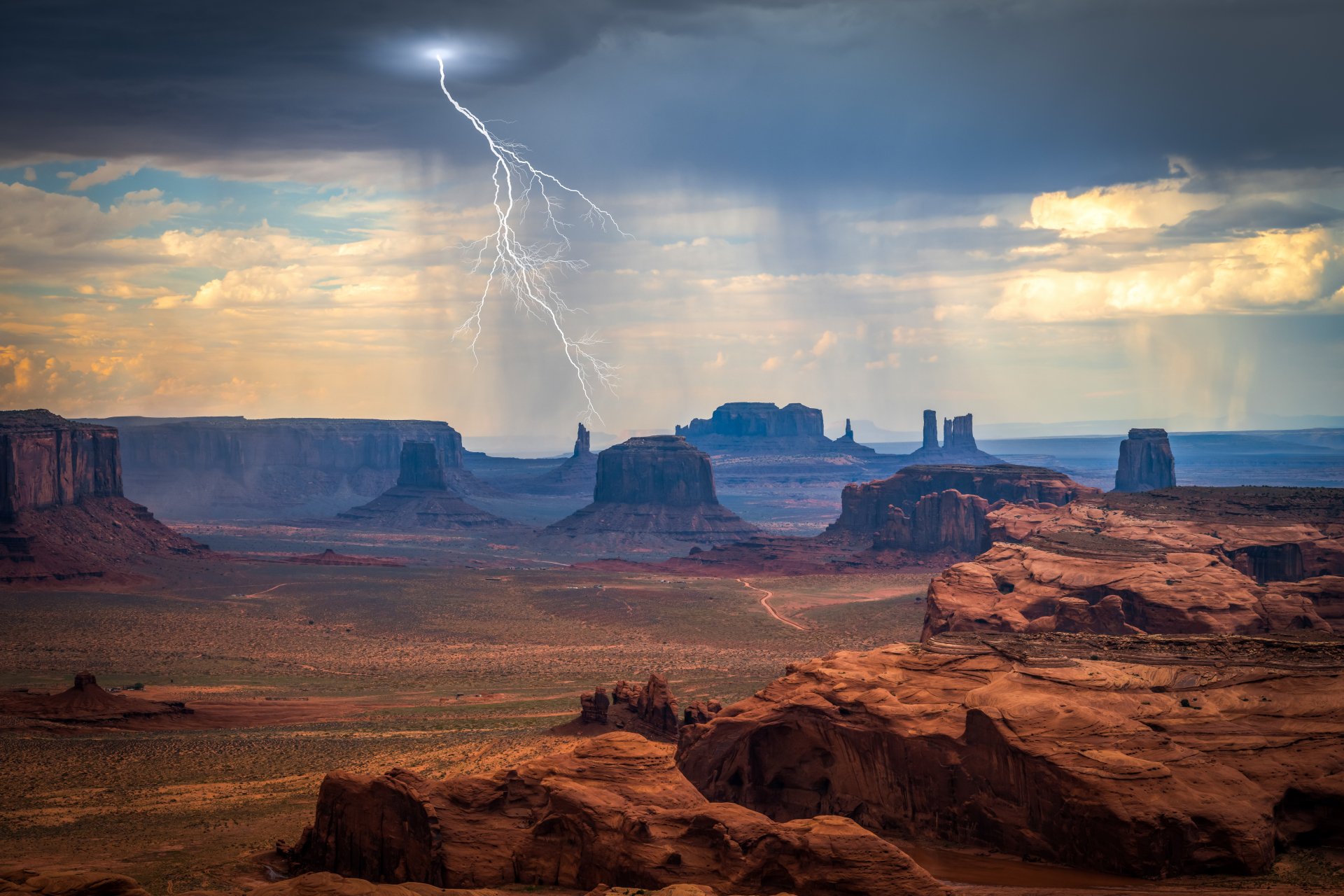 5K Ultra HD PC desktop wallpaper and background: Monument Valley desert landscape with red sandstone buttes and a dramatic lightning bolt under stormy skies.