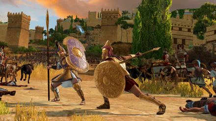 HD wallpaper of A Total War Saga: TROY, featuring epic battle scene with warriors clashing in front of ancient city walls.