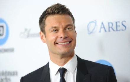Smiling man in suit at a formal event for HD desktop wallpaper and background.