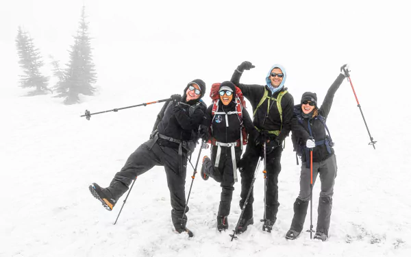HD desktop wallpaper of Inspiration4 team members happily posing in snow with ski equipment, creating an uplifting mood for background imagery.
