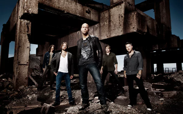 Rock band standing confidently in an abandoned building setting as an HD desktop wallpaper and background.