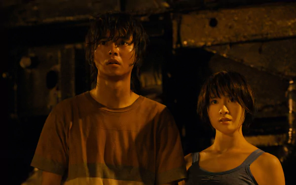 Moody 2K Quad HD PC desktop wallpaper: two drenched characters from the TV show Alice in Borderland stand in dim industrial light, faces tense and alert.